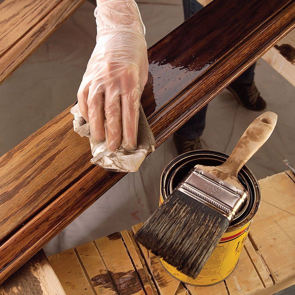 process of applying gray wood stain.