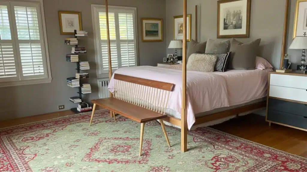 only the foot of the bed on the rug