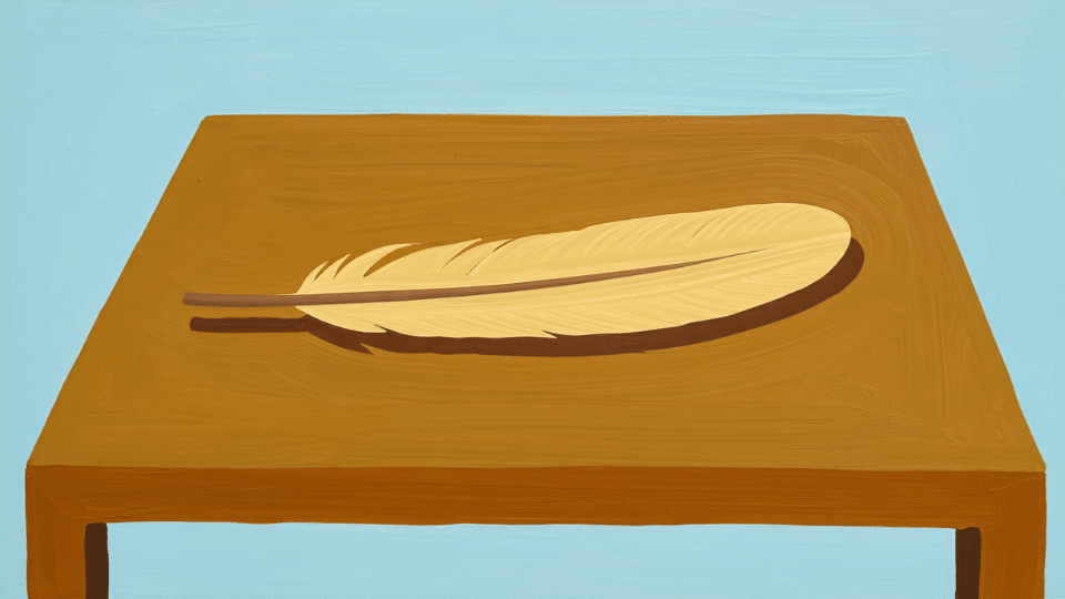 feather resting on a table